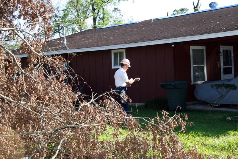 Local inspector completing a final review of a temporary roof repair